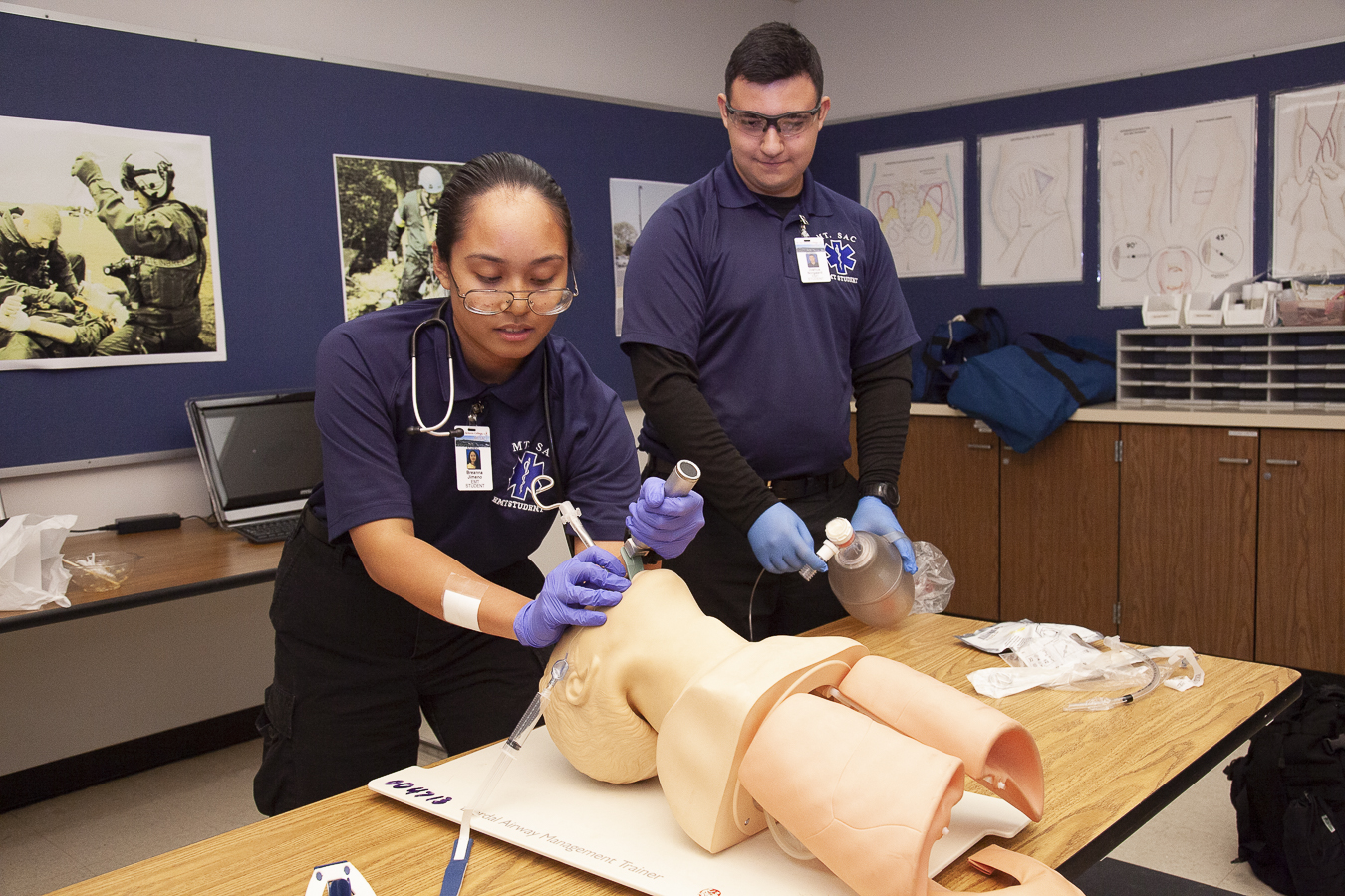 two emt students practicing intubation